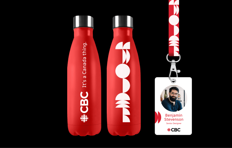 Red CBC water bottles and employee ID badge with new branding.