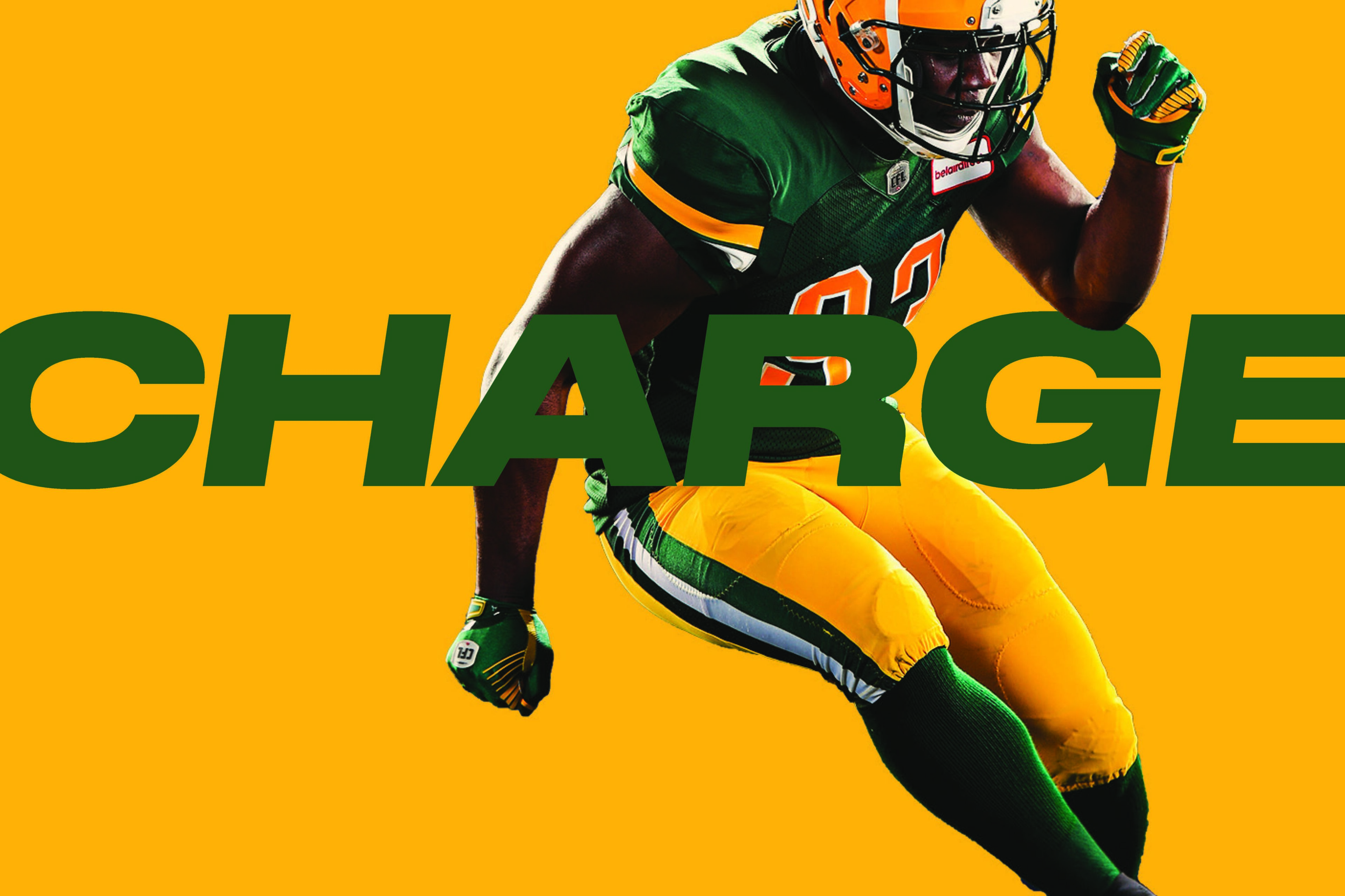 Edmonton Elks player running with the word 'CHARGE' in bold green on a yellow background